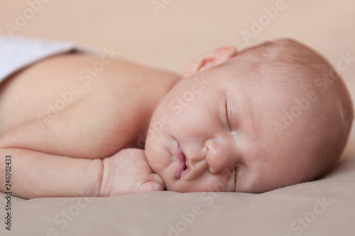 Portrait of cute sleeping newborn girl