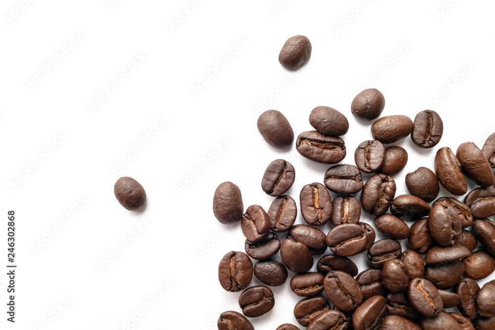 Roasted coffee beans isolated on white background. Close-up. Roasted coffee beans isolated on white background. Close-up.