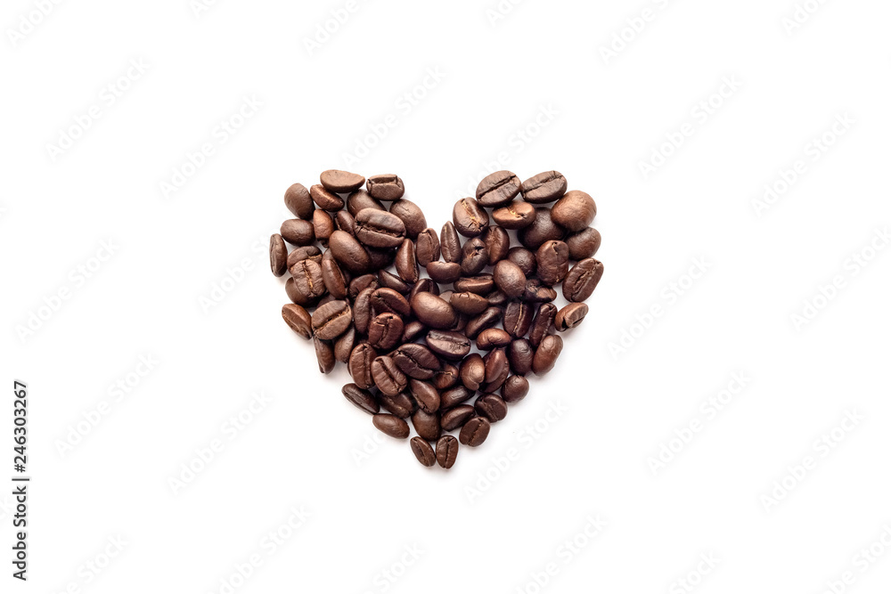 Heart shape of roasted coffee beans isolated on a white background. Heart shape of roasted coffee beans isolated on a white background.