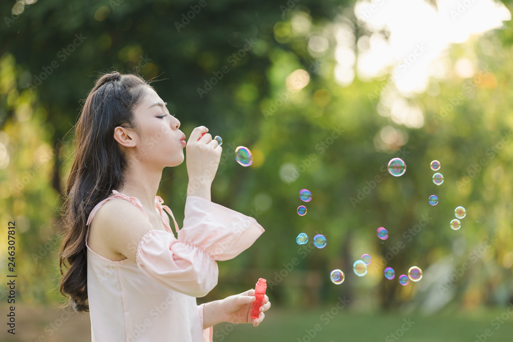 young woman with playing bubble balloons young woman with playing bubble balloons