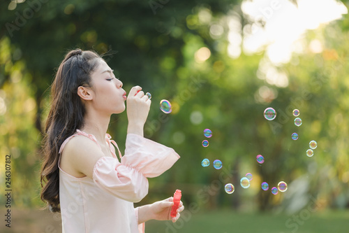 young woman with playing bubble balloons