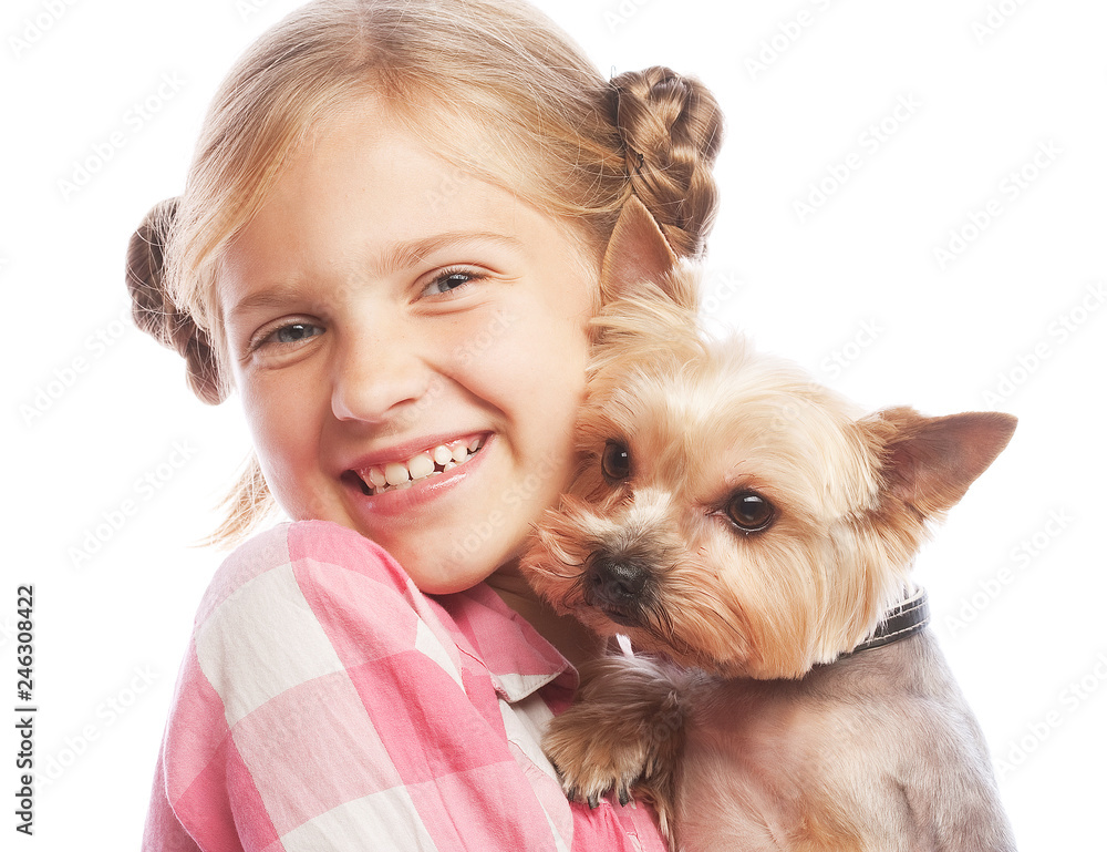 Portrait of an adorable young girl smiling holding Yorkshire Terrier puppy Portrait of an adorable young girl smiling holding Yorkshire Terrier puppy