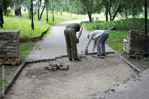 laid out tiles in the park © Семен Саливанчук