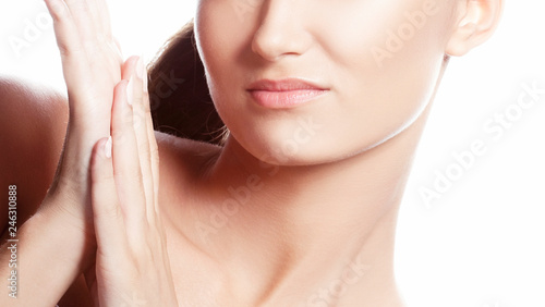 Part of face with lips of yong model girl. Skin care concept. Isolated on white background