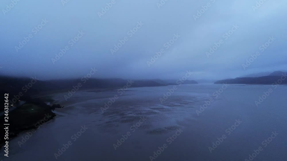 Flight over a lake at Barmouth Wales in the evening Flight over a lake at Barmouth Wales in the evening