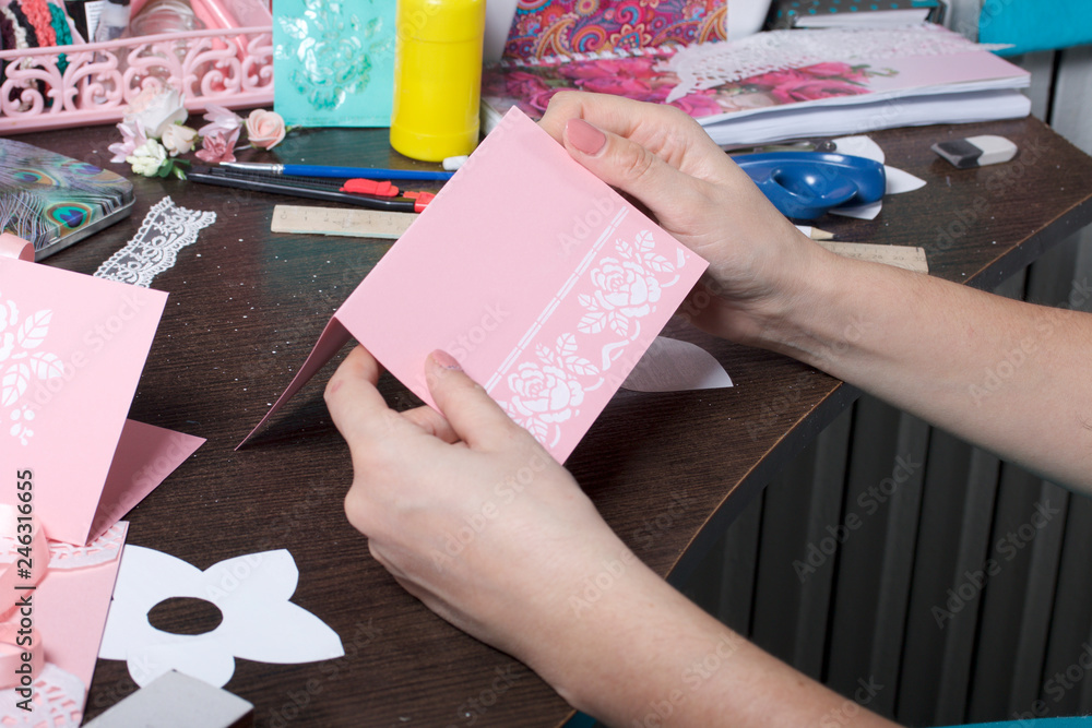 Making greeting cards from paper, cardboard and tape. Woman artisan at work. Making greeting cards from paper, cardboard and tape. Woman artisan at work.