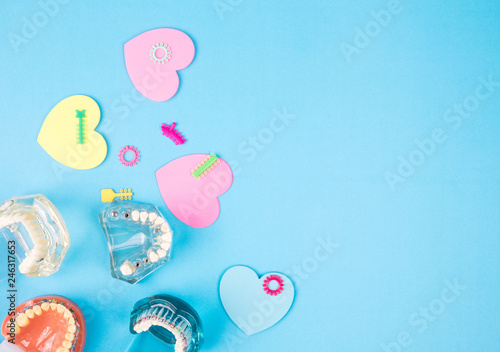 dentist tools and orthodontic on the  blue background, flat lay, top view. photo