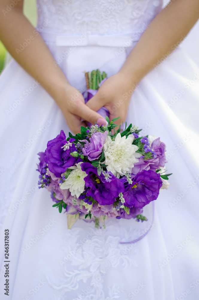 Beautiful wedding bouquet in hands of the bride. Wedding concept Beautiful wedding bouquet in hands of the bride. Wedding concept