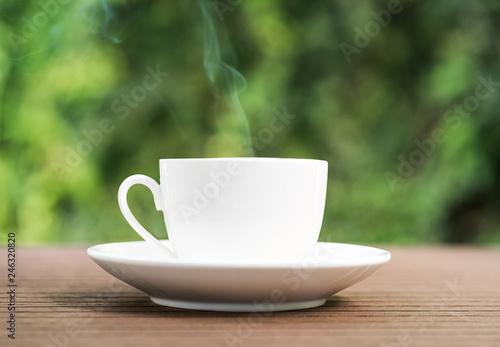 White ceramic coffee cup on wooden table