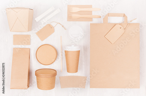 Concept design disposable brown paper pack for go food for restaurant, cafe, shop, advertising - bag, coffee cup, box for soup, noodles  on white wood board.