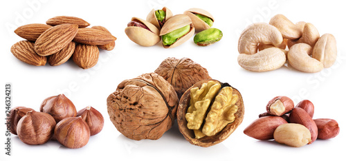 Walnut, pistachios, hazelnut, peanuts, almonds, cashews isolated on white background.