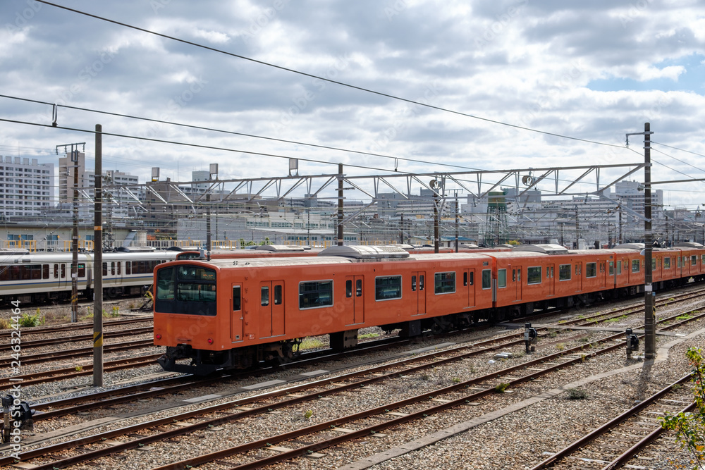 Vintage locomotive orange train in station