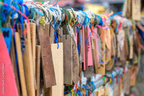 Plate wood hanging colorful thread on rail of traditional