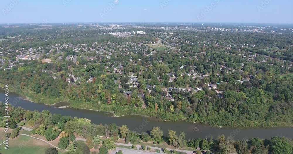 Aerial City By River And Forests And Trees Aerial City By River And Forests And Trees