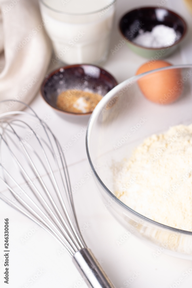 ingredients for baking flour, eggs, mloko on a white background. ingredients for baking flour, eggs, mloko on a white background.