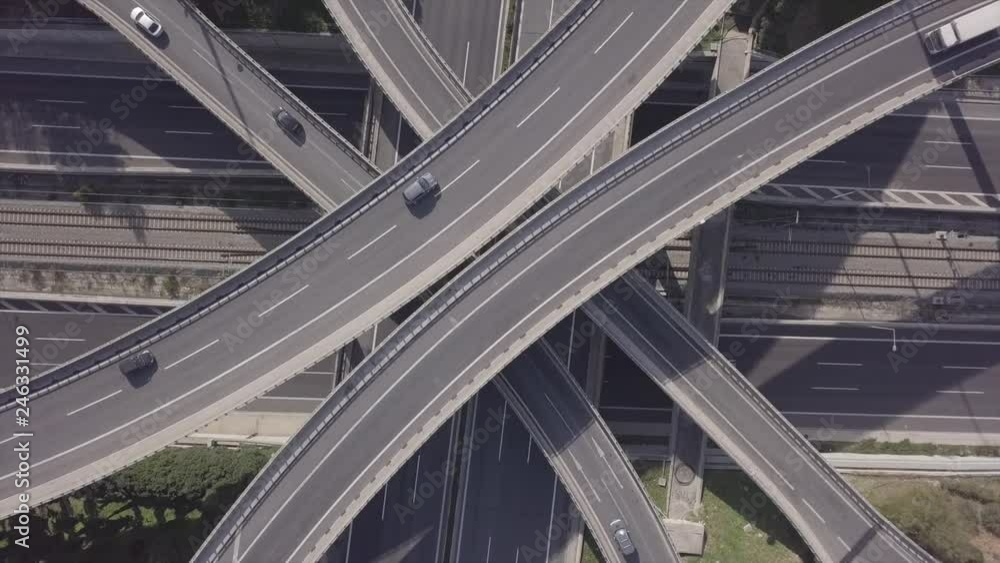Aerial drone top view video of highway junction multi level overpass passing through city centre Aerial drone top view video of highway junction multi level overpass passing through city centre