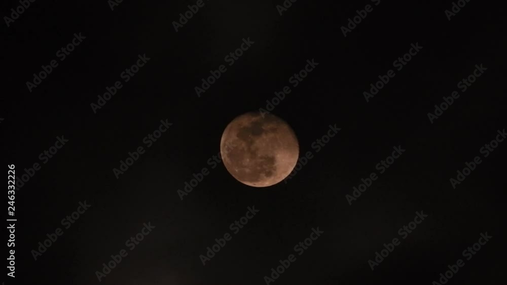 Extreme zoom photo of moon at night with deep dark clouds and strong wind Extreme zoom photo of moon at night with deep dark clouds and strong wind