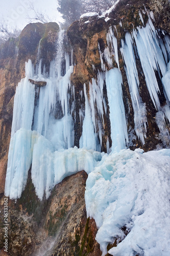 Frozen waterfall in the winter © Xalanx