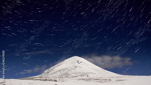 Mountain peak and stars