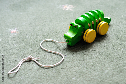 Small wooden child's toy. Pull along crocodile on wheels