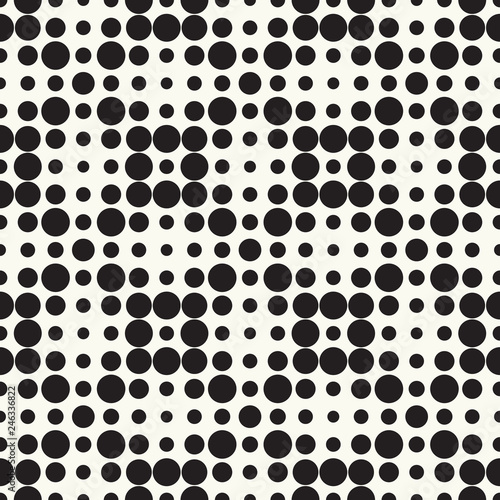 Seamless vector pattern halftone design. Modern textile print with black dots. Monochrome fashion background. Grid of circles.