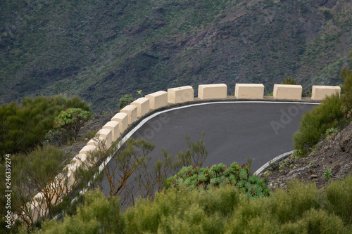 Empty curve in mountain road, top view