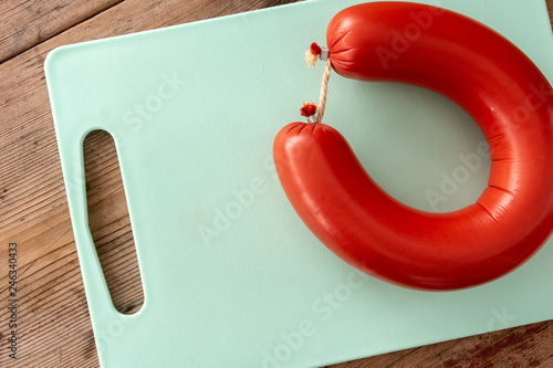a round sausage on a cutting board