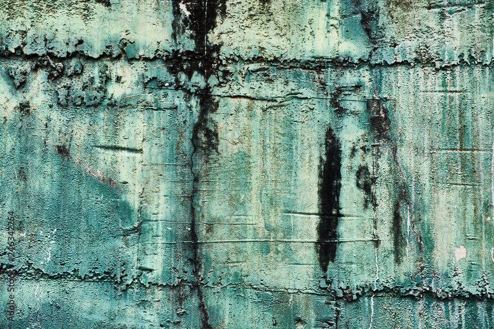 old shabby concrete wall of turquoise color
