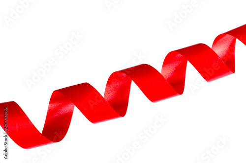 Red satin ribbon spiral on white background, concept