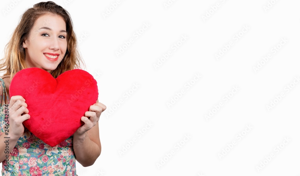 pretty smiling young woman with a red heart on white pretty smiling young woman with a red heart on white
