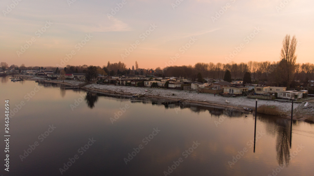 Houses at a lake at Golden Hour in winter