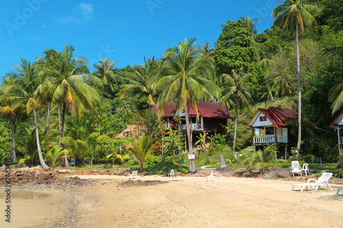 Beautiful bungalows amongst palm trees on the Koh Wai island, Thailand