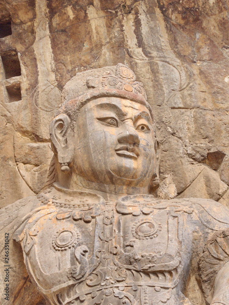 Fototapeta premium Luoyang Longmen grottoes. Broken Buddha and the stone caves and sculptures in the Longmen Grottoes in Luoyang, China. Taken in 14th October 2018