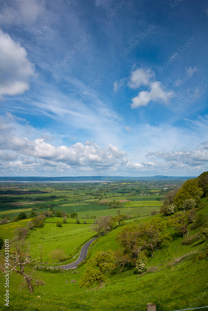 Obraz premium Coaley Peak viewpoint view over The Severn Vale from the Cotswold escarpment near Nympsfield, Gloucestershire, UK