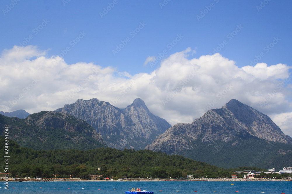scenic and beautiful view of mountains and white clouds on peaks