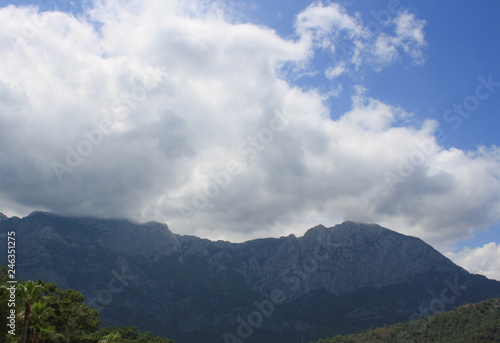 scenic and beautiful view of mountains and white clouds on peaks