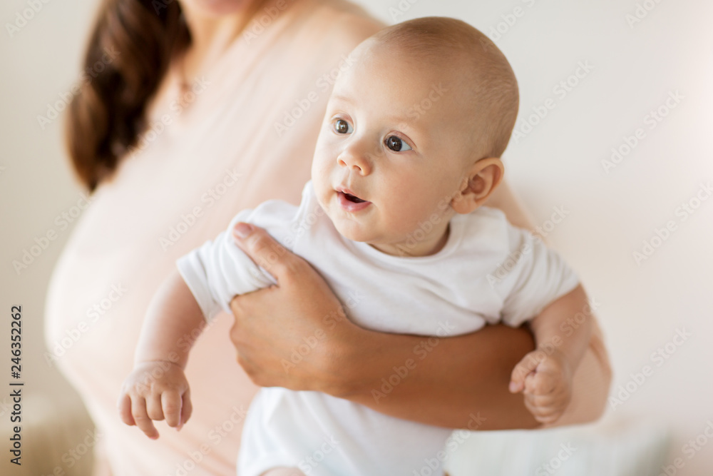 family, motherhood and people concept - close up of mother with little baby boy at home family, motherhood and people concept - close up of mother with little baby boy at home