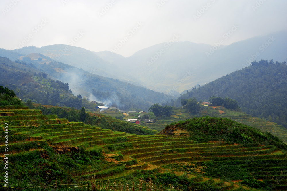 Beautiful landscape with green field on mountains and cloudy sky in Sa Pa, Vietnam