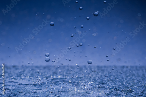 Wallpaper Mural large aindrops crashing to surface on blue background Torontodigital.ca