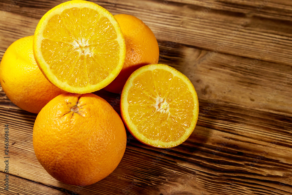 Fresh oranges on wooden table Fresh oranges on wooden table