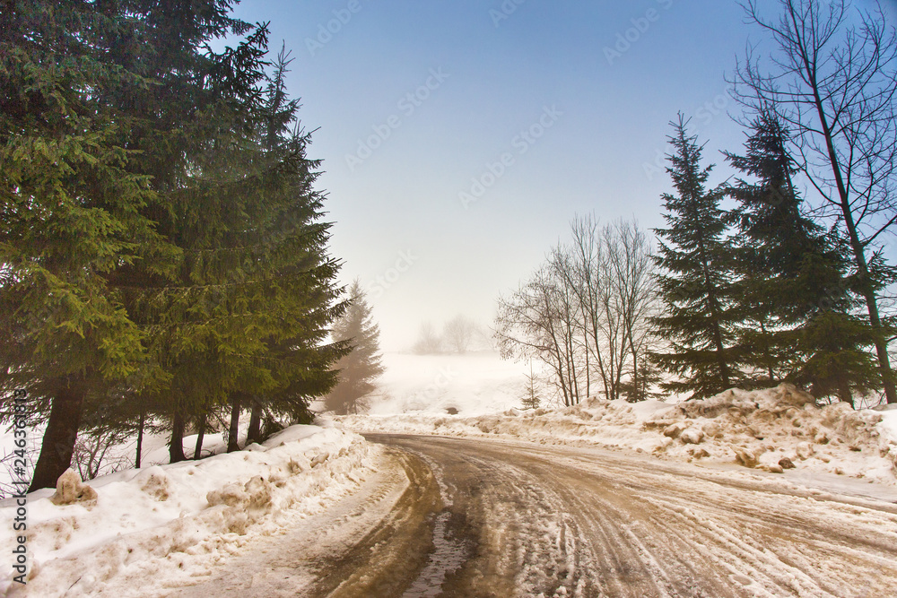 Melting Snow on mountain country road Melting Snow on mountain country road