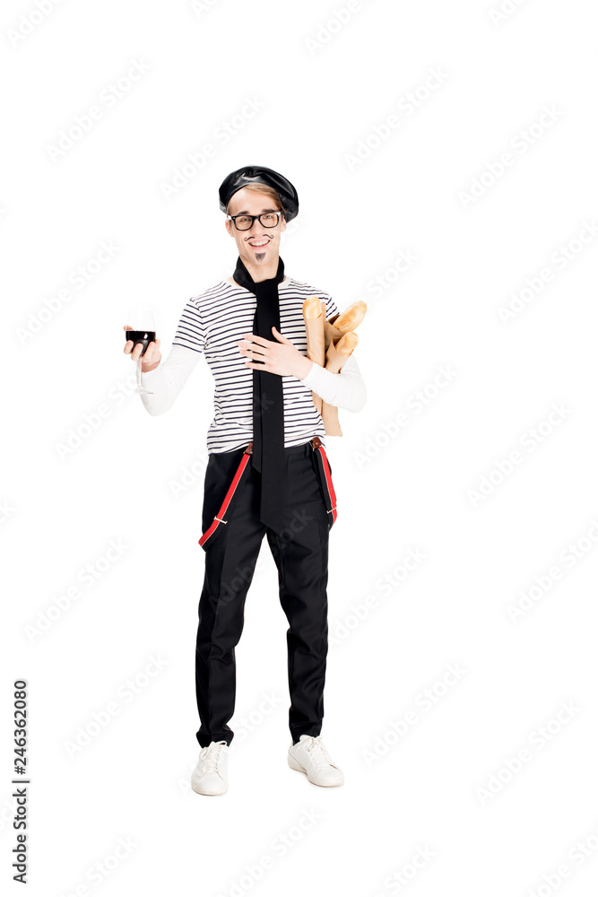 smiling french man holding glass of wine and baguettes isolated on white smiling french man holding glass of wine and baguettes isolated on white