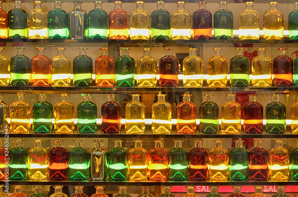 Multi-colored bottles in the window.
