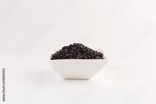 bowl of black wild rice isolated on white background