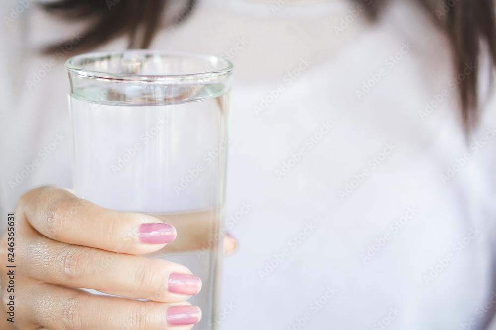 closeup healthy woman hand holding glass of fresh water closeup healthy woman hand holding glass of fresh water