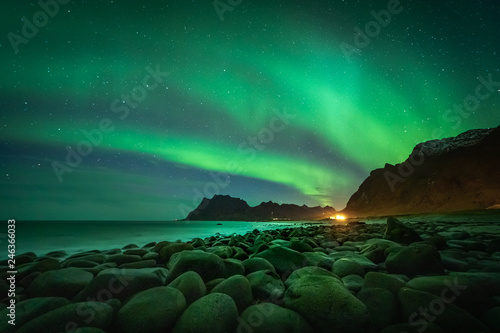 Lofoten aurora above moutains and sea © PawelUchorczak