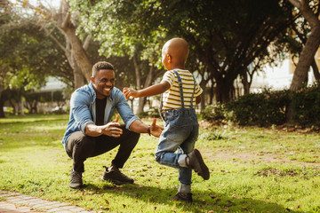 Son running into father's arms