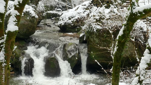 Schiessentuempel Waterfall near Mullerthal in Mullerthal Valley in winter, Echternach, Luxembourg, Europe photo