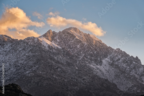 Snow capped peak of Monte Grosso mountain in Corsica