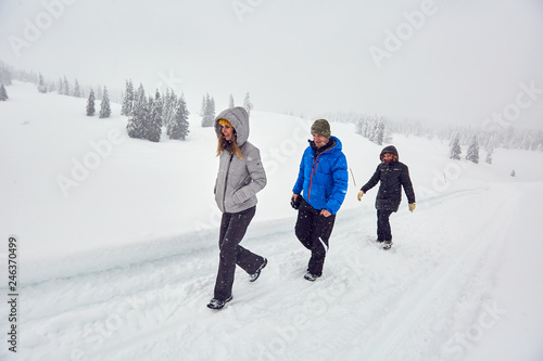 Friends hiking on a snowy trail
